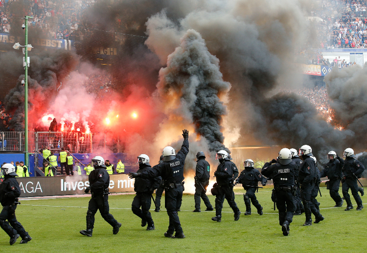 Police have to be called after Hamburg SV threw flares in the ground after club's relegation