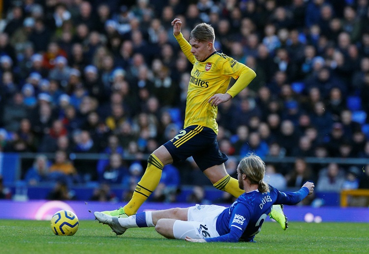 Emile Smith Rowe protects the ball against Everton's Tom Davies in their Premier League clash