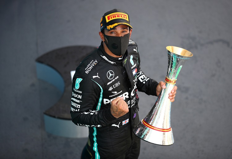 Lewis Hamilton celebrates after claiming the Spanish Grand Prix title