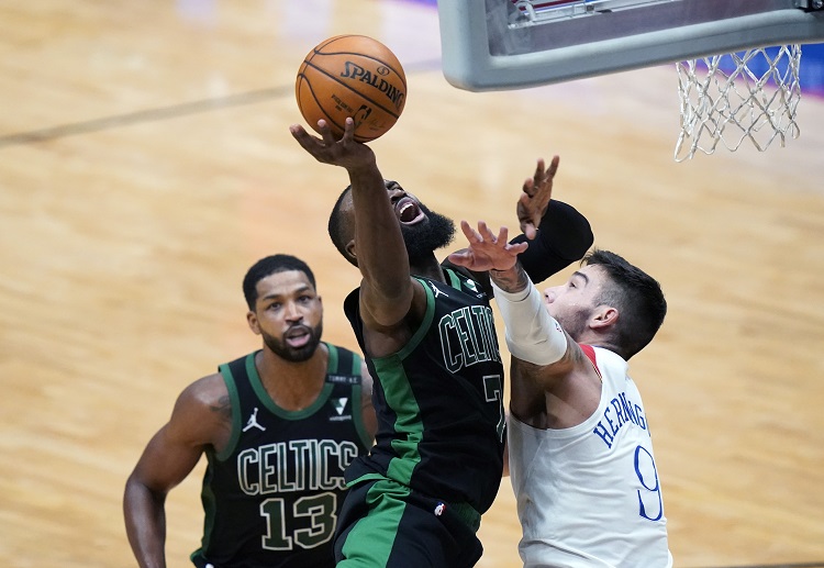 Boston Celtics guard Jaylen Brown battle it out against New Orleans Pelicans players in an NBA match