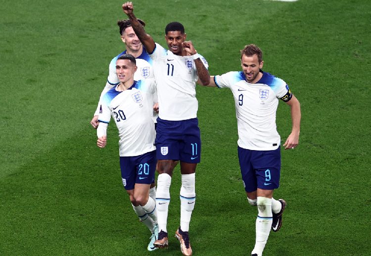 Marcus Rashford celebrates after scoring a goal against Iran during their World Cup 2022 opener