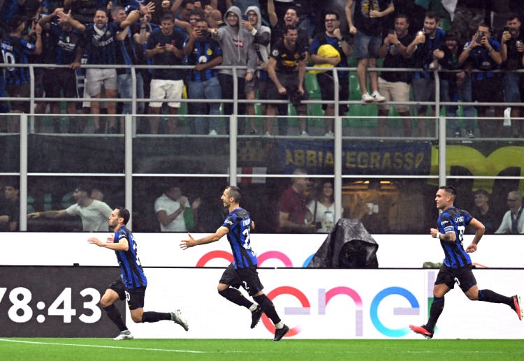 Hakan Calhanoglu scores the fourth goal of Inter against AC Milan in Serie A